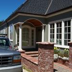 Windows, entrance, and brickwork designed and built by Brian Sullivan.